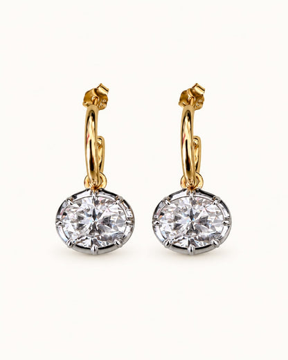 Forte oval moissanite bezel earrings with gold hoops and silver-tone pendants, front view of the pair